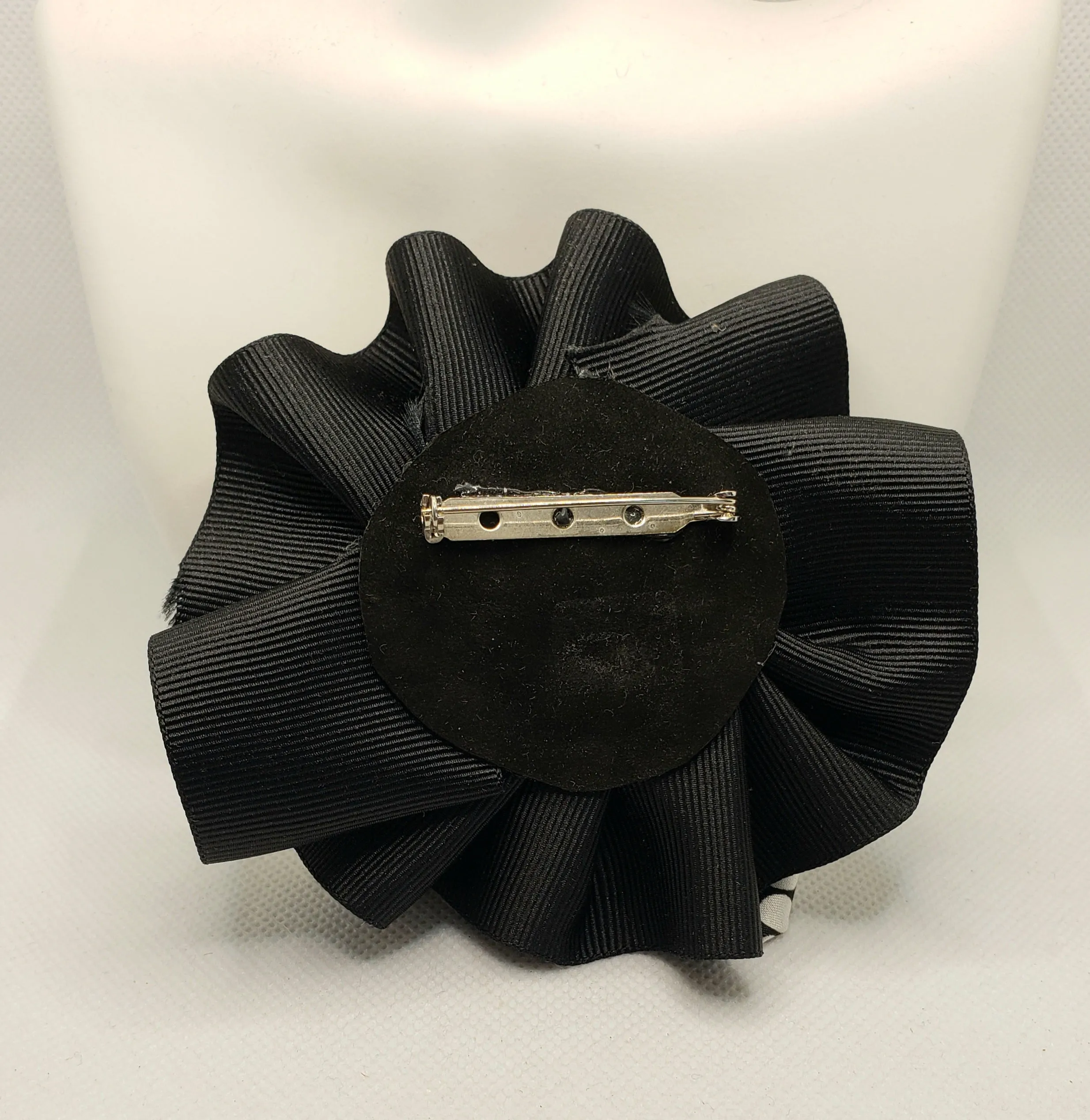 Black and white checked broach